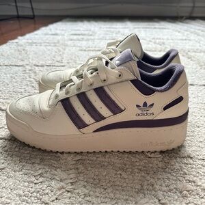 Adidas woman’s purple striped sneaker